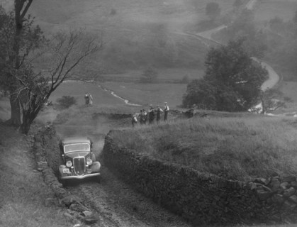 Ford V8 saloon of F Allott competing in the MCC Sporting Trial, 1935. Artist: Bill Brunell.