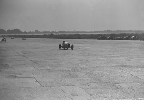 Delage racing at a Surbiton Motor Club race meeting, Brooklands, Surrey, 1928. Artist: Bill Brunell.
