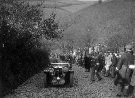 MG Magnette of JW Fox competing in the MCC Lands End Trial, Beggars Roost, Devon, 1936. Artist: Bill Brunell.