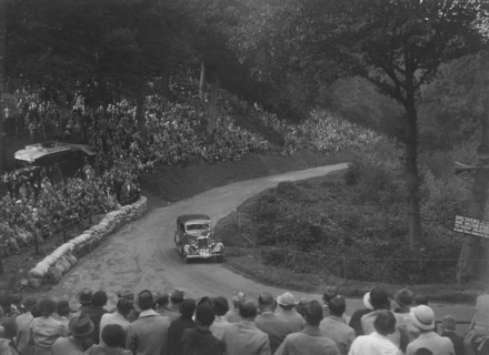 Ford V8 saloon competing in the Shelsley Walsh Hillclimb, Worcestershire, 1935. Artist: Bill Brunell.