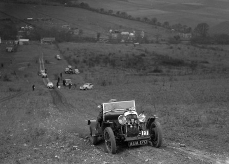 Lagonda Rapier competing in the London Motor Club Coventry Cup Trial, Knatts Hill, Kent, 1938. Artist: Bill Brunell.