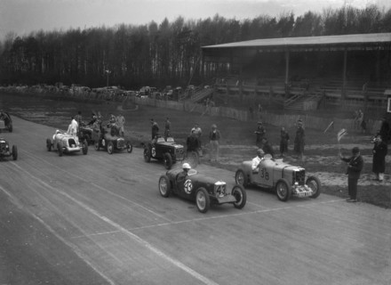 Riley Brooklands of H Hodgson and MG Magnette of H Levy, Donington Park, Leicestershire, 1935. Artist: Bill Brunell.