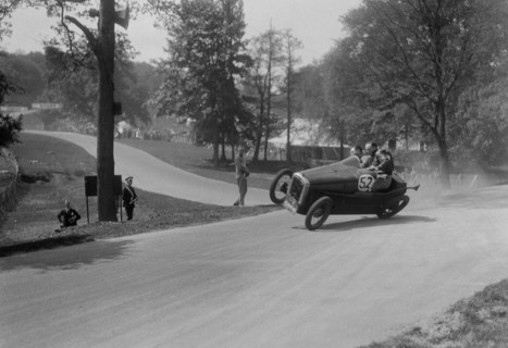 Austin 7 of B Sparrow about to crash, Donington Park Race Meeting, Leicestershire, 1933. Artist: Bill Brunell.