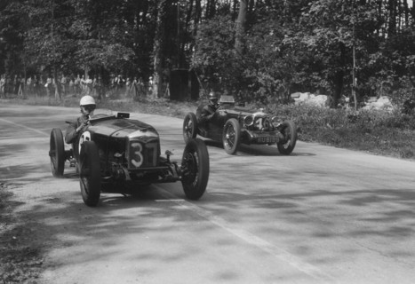 Two Riley Brooklands racing at Donington Park, Leicestershire, 1930s. Artist: Bill Brunell.