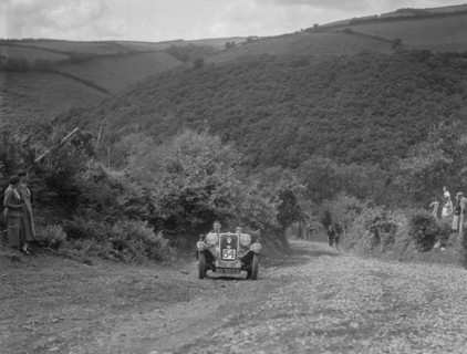 Singer 2-seater competing in the Mid Surrey AC Barnstaple Trial, Beggars Roost, Devon, 1934. Artist: Bill Brunell.