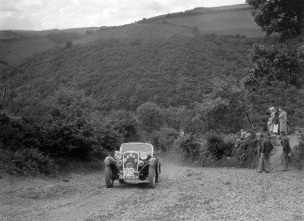 Singer sports competing in the Mid Surrey AC Barnstaple Trial, Beggars Roost, Devon, 1934. Artist: Bill Brunell.