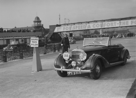 Bentley 4-seater tourer of GG Wood competing in the JCC Rally, Brooklands, Surrey, 1939. Artist: Bill Brunell.