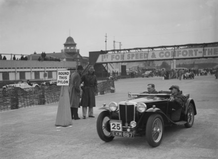 MG TA competing in the JCC Rally, Brooklands, Surrey, 1939. Artist: Bill Brunell.