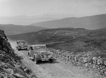 Riley of Miss F Walker leading a Hudson Eight at the RSAC Scottish Rally, 1936. Artist: Bill Brunell.