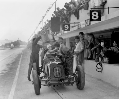ERA R4C of Raymond Mays refuelling in the pits, JCC International Trophy, Brooklands, Surrey, 1937. Artist: Bill Brunell.