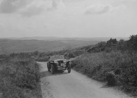 MG TA of JL Lutwyche competing in the MCC Torquay Rally, 1938. Artist: Bill Brunell.