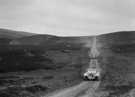SS Jaguar 100 open 2-seater and Humber saloon competing in the RSAC Scottish Rally, 1939. Artist: Bill Brunell.
