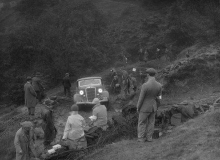 Ford V8 drop head coupe of GM Denton competing in the MCC Sporting Trial, 1935. Artist: Bill Brunell.