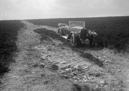 Kitty Brunell road testing a Riley 9 WD tourer, c1930. Artist: Bill Brunell.
