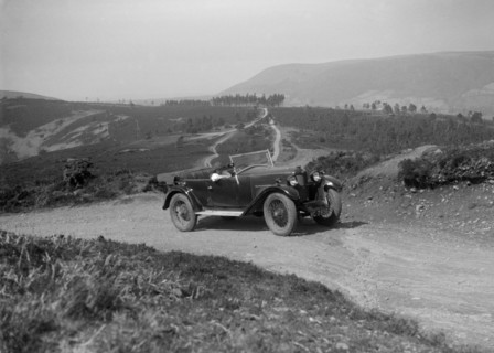 Kitty Brunell road testing a Riley 9 WD tourer, c1930. Artist: Bill Brunell.