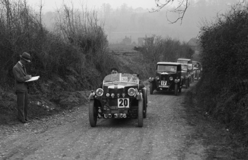 MG M Type and Riley saloon competing in the JCC Half-Day Trial, 1930. Artist: Bill Brunell.