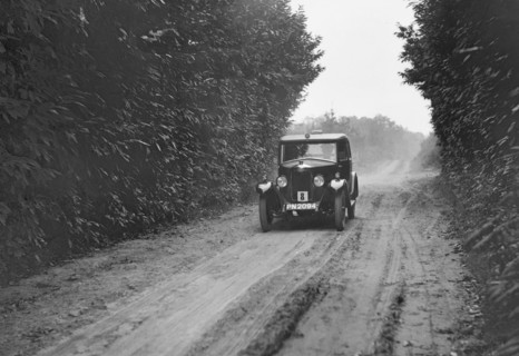 Riley Monaco saloon competing in the Brighton & Hove Motor Club Trial, 1920s. Artist: Bill Brunell.