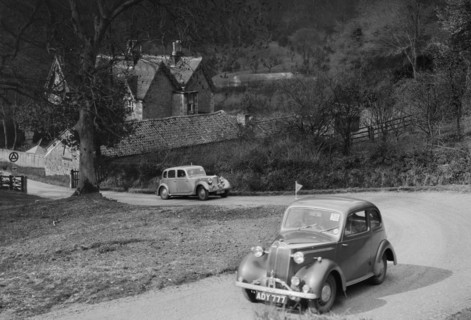 Vauxhall 10 of Miss IM Burton amd Rover of CG Dunham competing in the RAC Rally, 1939. Artist: Bill Brunell.