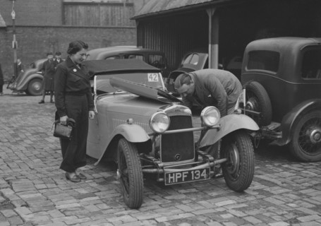 AES Curtis looking under the bonnet of his HRG at the RAC Rally, 1939. Artist: Bill Brunell.