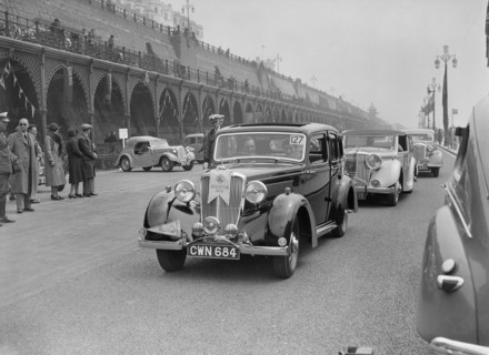 Riley 4-door saloon of AS Bassett at the RAC Rally, Madeira Drive, Brighton, 1939. Artist: Bill Brunell.