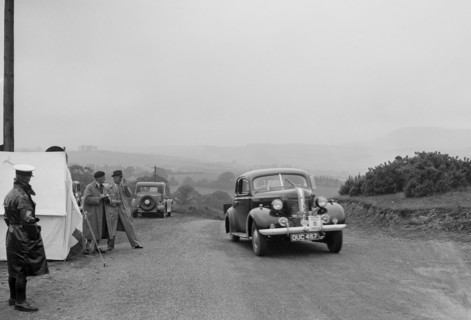 Pontiac saloon of J Owen-Smith competing in the South Wales Auto Club Welsh Rally, 1937 Artist: Bill Brunell.