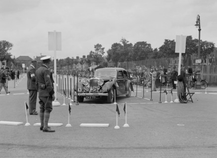 Jaguar SS saloon of DS Hand competing in the South Wales Auto Club Welsh Rally, 1937 Artist: Bill Brunell.