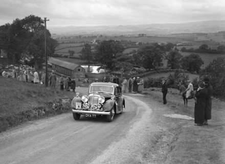 Jaguar SS saloon of DS Hand competing in the South Wales Auto Club Welsh Rally, 1937 Artist: Bill Brunell.