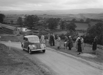 Ford V8 saloon of Viscountess Chetwynd competing in the South Wales Auto Club Welsh Rally, 1937 Artist: Bill Brunell.