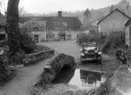 Kitty Brunell driving a Ford Model A 2-seater, Winsford, Somerset, 1930s. Artist: Bill Brunell.