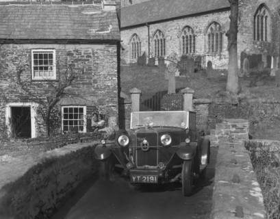Talbot 14/45 tourer on the packhorse bridge, Altarnun, Cornwall, c1930. Artist: Bill Brunell.