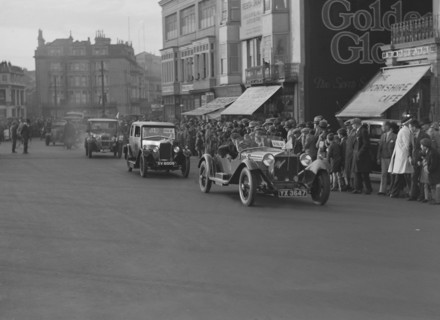 Alfa Romeo and Riley taking part in the London-Brighton Run, 1928. Artist: Bill Brunell.