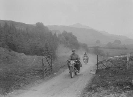 493 cc Triumphs of L Crisp and KP Jones competing in E&DMC Scottish 6 Days Trial, 1933.. Artist: Bill Brunell.