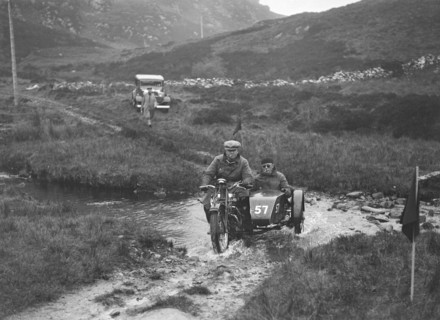 493 cc Triumph and sidecar of HS Perry competing in E&DMC Scottish 6 Days Trial, 1933.. Artist: Bill Brunell.