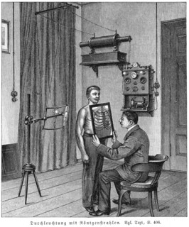 Examining a patient's thorax using an X-ray tube and fluorescent screen, 1903. Artist: Unknown