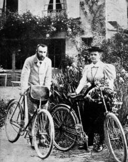 Pierre and Marie Curie, French physicists, preparing to go cycling. Artist: Unknown