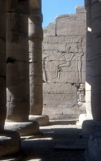 View through to relief of Rameses II before Amun & Mut, Temple of Rameses II, Luxor, Egypt. Artist: Unknown