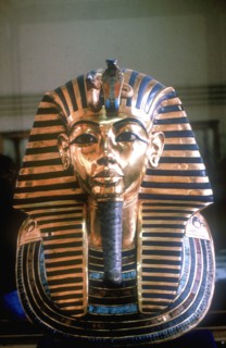 Gold mask of Tutankhamun on his mummy-case. Artist: Unknown
