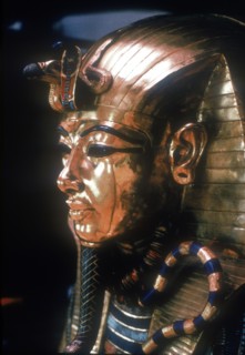 Gold mask of Tutankhamun on the second coffin. Artist: Unknown