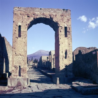 Arch of Caligula with Vesuvius beyond, Pompeii, Italy. Creator: Unknown.