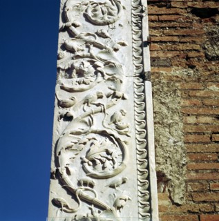Decoration on the jamb of the dooway of the Building of Eumachia in the Forum, Pompeii, Italy. Creator: Unknown.