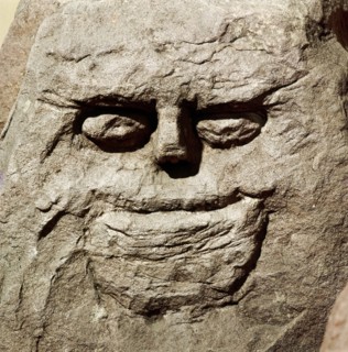 Stone head from pagan Celtic shrine at Cinderford, Gloucestershire. Artist: Unknown