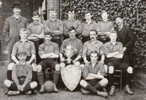 Rowntree Football Club 1st team pose with trophy and cup, York, Yorkshire, 1902. Artist: Unknown