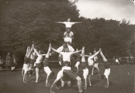 Boys pose in an outdoor gym lesson, 1929. Artist: Unknown