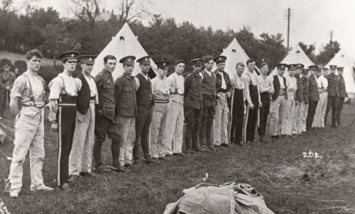Rowntree boys line up for inspection outside their tents, Coniston, Cumbria, summer 1913. Artist: Unknown