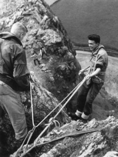 Boy about to start descent of rock face, Outward Bound School, Eskdale, Cumbria,1950. Artist: Unknown
