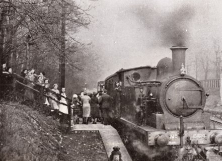 Passengers queuing for a steam rain at Rowntree's halt, York, Yorkshire, 1934. Artist: Unknown
