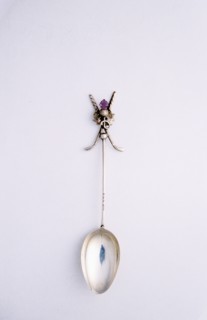 Silver spoon with crossed golf club motif, British, c1920s. Artist: Unknown
