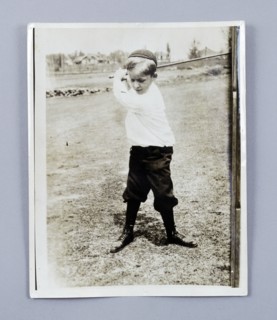 American golfer Bobby Jones playing as a young child, c1909. Artist: Unknown