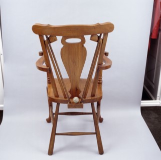 Oak chair carved with a golfing theme, 1920s. Artist: Unknown