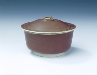 Ding persimmon red glazed covered bowl with white glazed interior, Jin dynasty, China, 12th century. Artist: Unknown